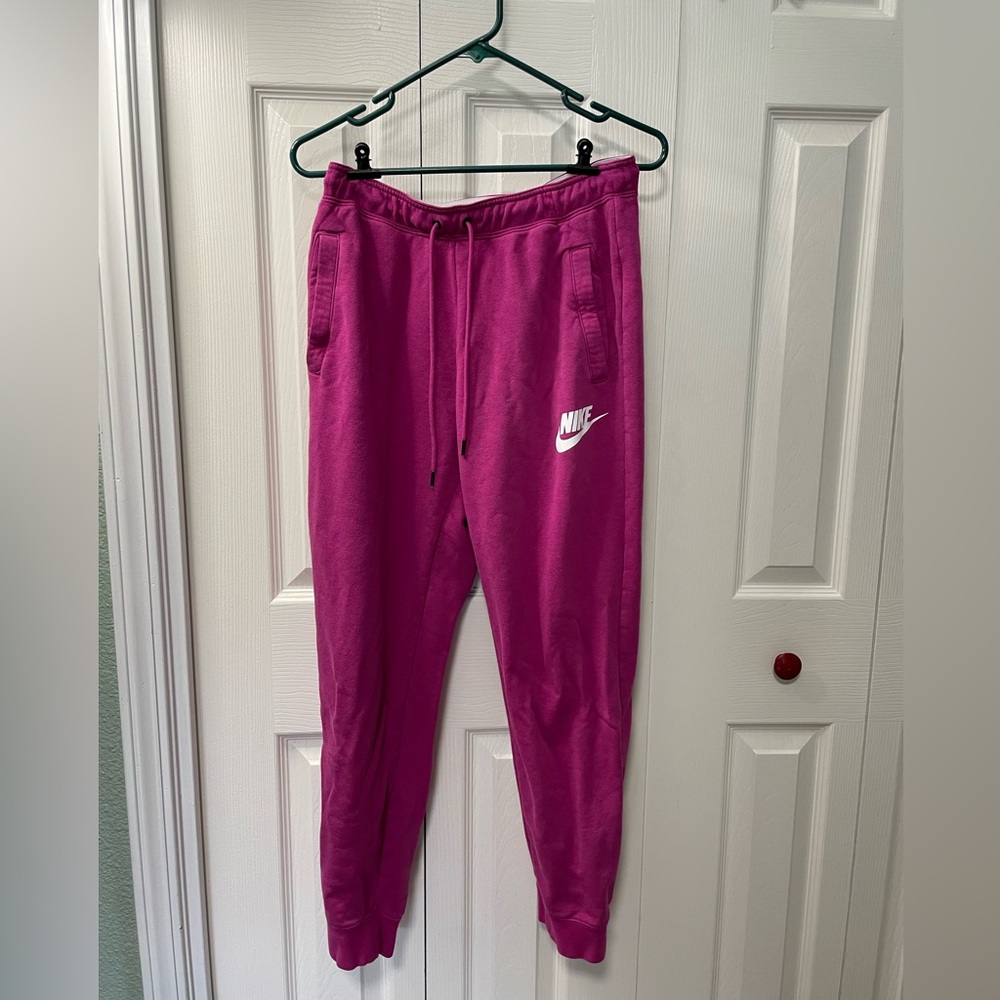 Pink Nike sweatpants, women’s, size medium.